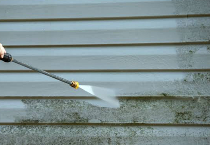 Brushing exterior siding green